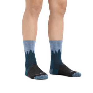 Outdoors Oriented Darn Tough women's merino wool hiking socks with a blue forest landscape pattern and cushioned foot