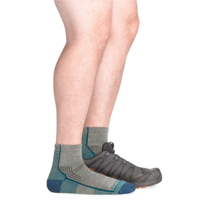 Outdoors Oriented Darn Tough 1959 Hiker Quarter midweight merino wool socks in grey and blue worn with a hiking shoe