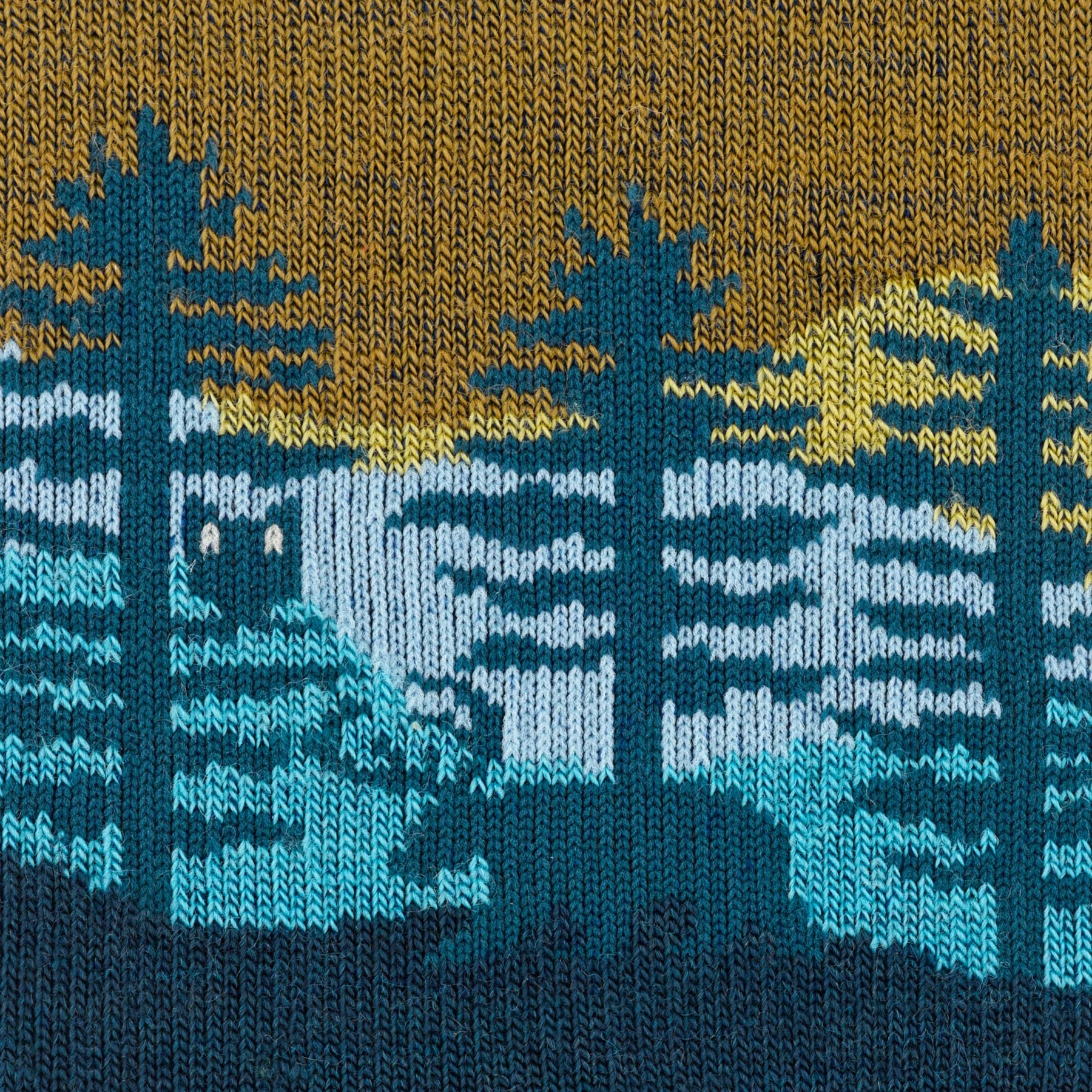 Outdoors Oriented Darn Tough Northwoods women's hiking sock fabric featuring a blue and yellow forest landscape pattern